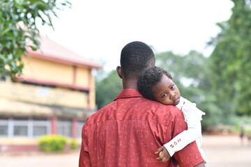 Portrait of a beautiful baby small girl with her father