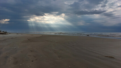 Stormy sky over the  Sea. The sun's rays make their way through the clouds.