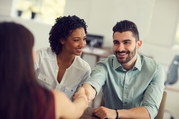 Office, meeting and couple with handshake in agreement for financial deal, negotiation and...