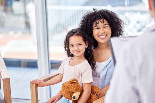 Mom, girl and happy in clinic with doctor for consultation or checkup with clipboard or document for information. Parent, daughter and medical at reception or waiting area for healthcare and wellness - Powered by Adobe