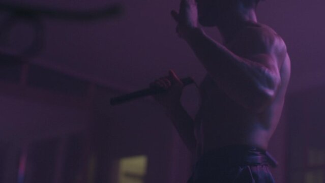 Man practicing his moves with nunchucks