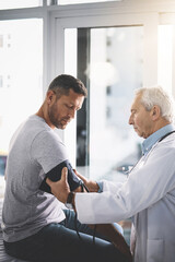 Obraz premium Medical, doctor and patient or man for blood pressure in healthcare with test for hypertension and wellness check. Health professional, person and consultation to monitor vital signs with assessment