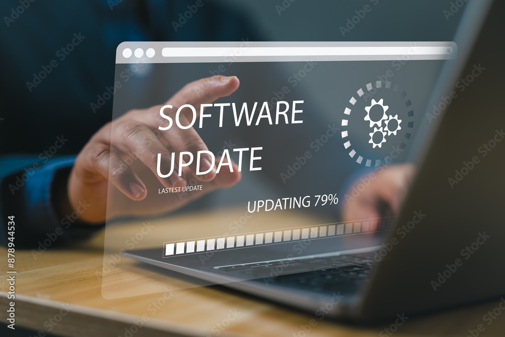 Fototapete Man working and installing update process. Software updates or operating system upgrades to keep your device up to date with enhanced functionality in new versions and improved security.