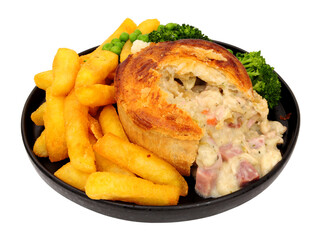 Creamy chicken, ham and leek pie meal with chips and mixed vegetables isolated on a white background