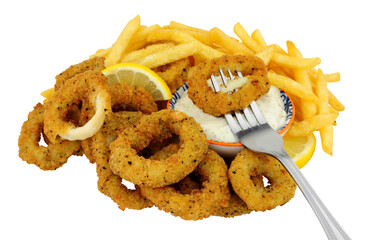 Breaded calamari squid rings with French fries and tartar dipping sauce isolated on a white background