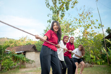 Portrait of Indonesian woman celebrate Indonesia Independence Day with traditional events like a...