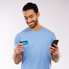 Man, phone and credit card in studio for online payment, invest and shopping on white background. Male person, banking website and bills or transaction approval, ecommerce and app for money transfer