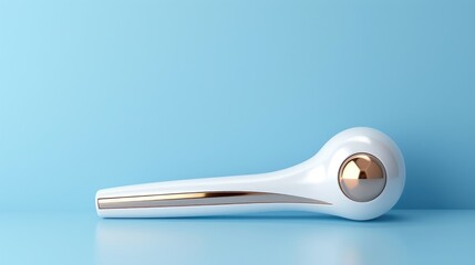 Luxurious facial massager on blue background for youthful skin care