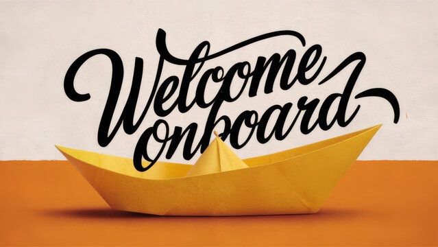 Yellow paper boat with "Welcome Onboard", handwriting message for new team members
