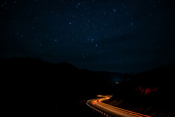 road mountains stars tracks night backlight