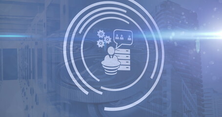 Image of business icons over cityscape