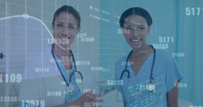 Stock market data processing over diverse female doctor and health worker discussing at hospital