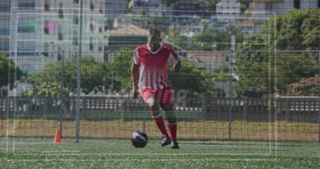 Image of interface processing data over biracial male footballer ball training on pitch