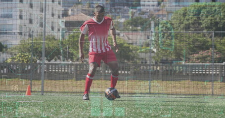 Image of interface processing data over biracial male footballer training on pitch with ball