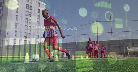 Image of interface processing data over biracial male footballer training on pitch with team