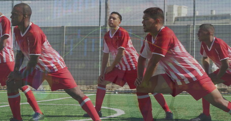 Image of interface processing data over diverse male footballers stretching on pitch