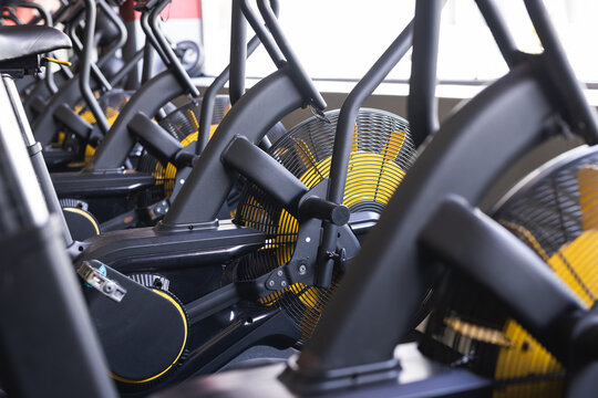 Rowing machines await users in a well-equipped gym