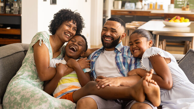 Diverse family enjoys a playful moment at home