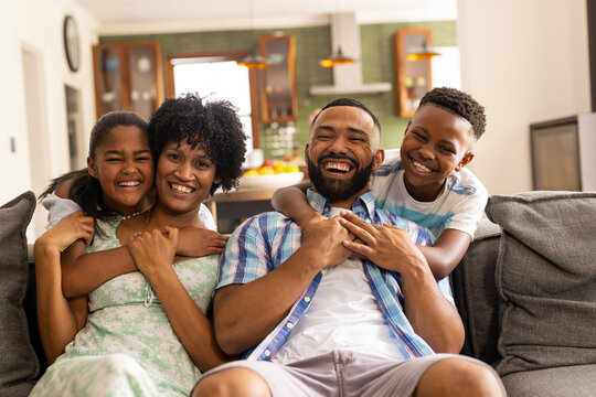 African American family enjoys a cheerful moment at home