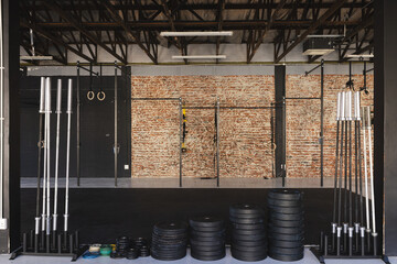 A well-equipped gym with various workout equipment, with copy space