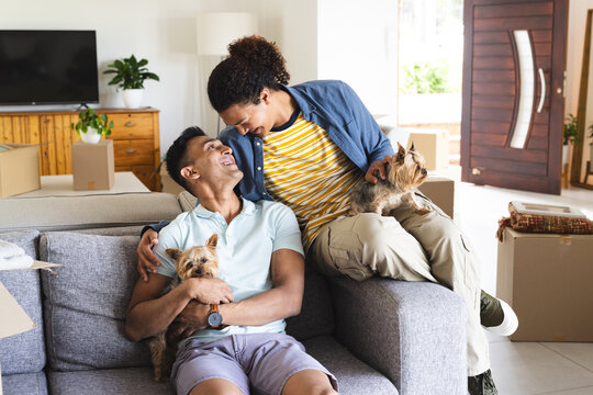 Gay biracial couple enjoys a cozy moment at home