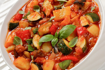 hearty italian vegetable stew in bowl, top view