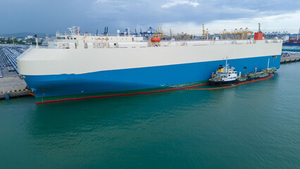 Oil ship refueling to Cargo ship at dock, Refueling at sea Oil products ship fuelling a large Bulk...