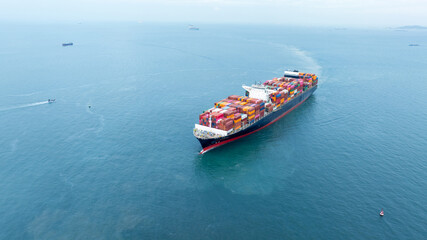 Cargo container ship carrying container and running in the ocean near international container port...