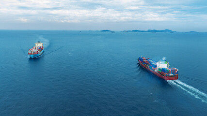 Obraz premium Cargo container ship carrying container and running in the ocean near international container port customs shipyard sea port concept smart logistic service. transportation logistics trading..