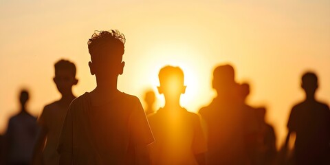 Fototapeta premium Silhouettes of migrants or refugees on World Refugee Day. Concept World Refugee Day, Immigration Crisis, Forced Displacement, Humanitarian Aid, Seeking Asylum,