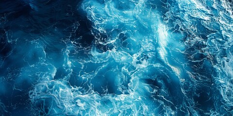 Fototapeta premium A breathtaking aerial view showcases the ocean's deep blue expanse with white waves crashing and splashing, captured from a drone's perspective