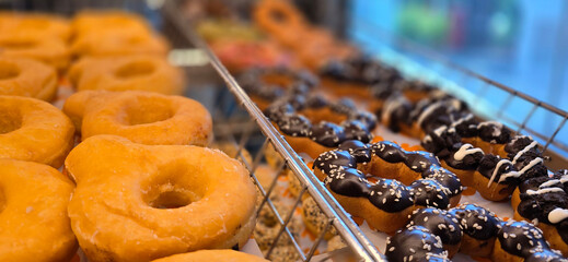 Delicious assortments of sugary donuts with different flavors and colorful topping good for backgrounds and multimedia content