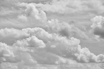 Black-and-white image of cumulus clouds in the sky, closeup