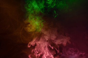 Yellow and pink steam on a black background.