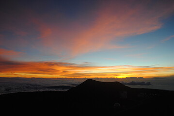 Obraz premium sunset over the clouds in the mountains 