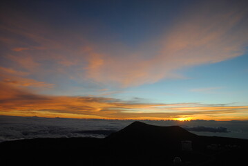 beautiful sunset view over the clouds in the mountains 