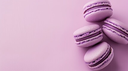 Macaron dessert on a plain background with space for text. French cookies. Small sweet with filling. Meringue with cream