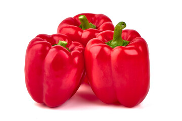 Red ripe bellpeppers, isolated on white background.