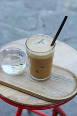 cold freddo cappuccino on a table outdoors