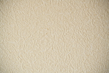 クローズアップしたベージュの壁紙