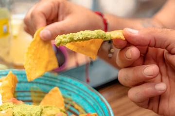 Nachos with guacamole and salsa, mexican restaurant