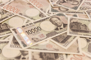 Japan's new banknotes. Image of a large number of 10,000 yen notes laid out.
