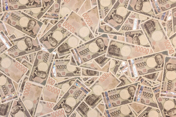 Japan's new banknotes. Image of a large number of 10,000 yen notes laid out.