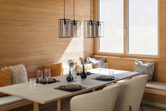 Elegant table setting with modern decor and wine glasses