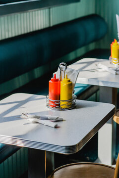 ketchup and mustard on table in diner