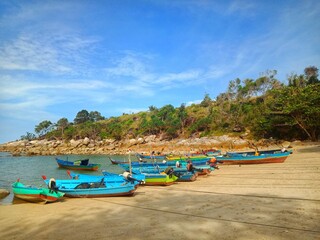 Blue fishing boat on the Turun Aban beach, Bangka island