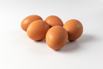 Fresh Chicken Eggs, close-up of eggs on white.