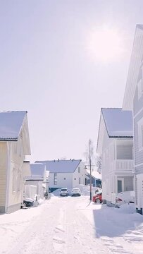 Snow-Covered Village Path on a Bright Winter Day
