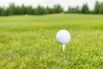 golf ball on green grass text here