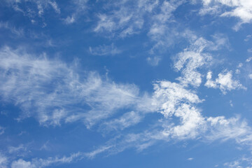 Blue sky and white puffy clouds.